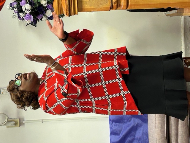 Woman in red checkered top