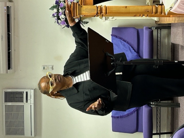 Woman in black speaking